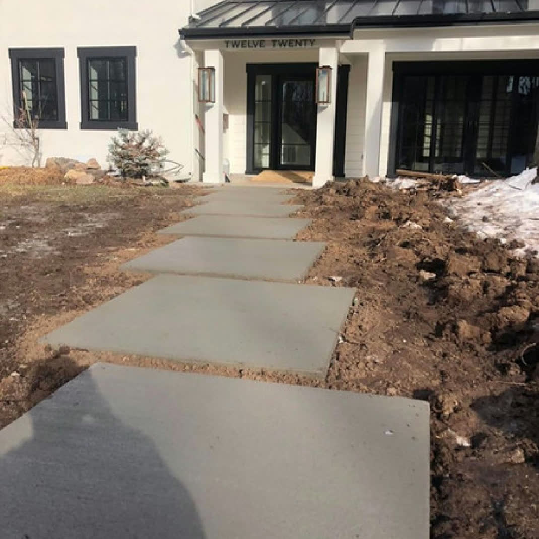 Concrete paver walkway to a home entrance