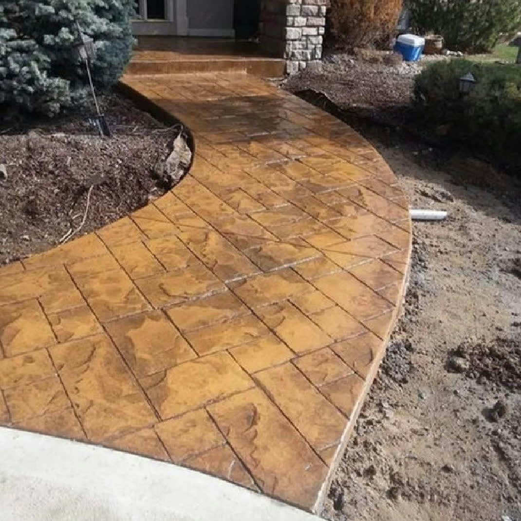 Stamped and colored concrete walkway by Segal Concrete