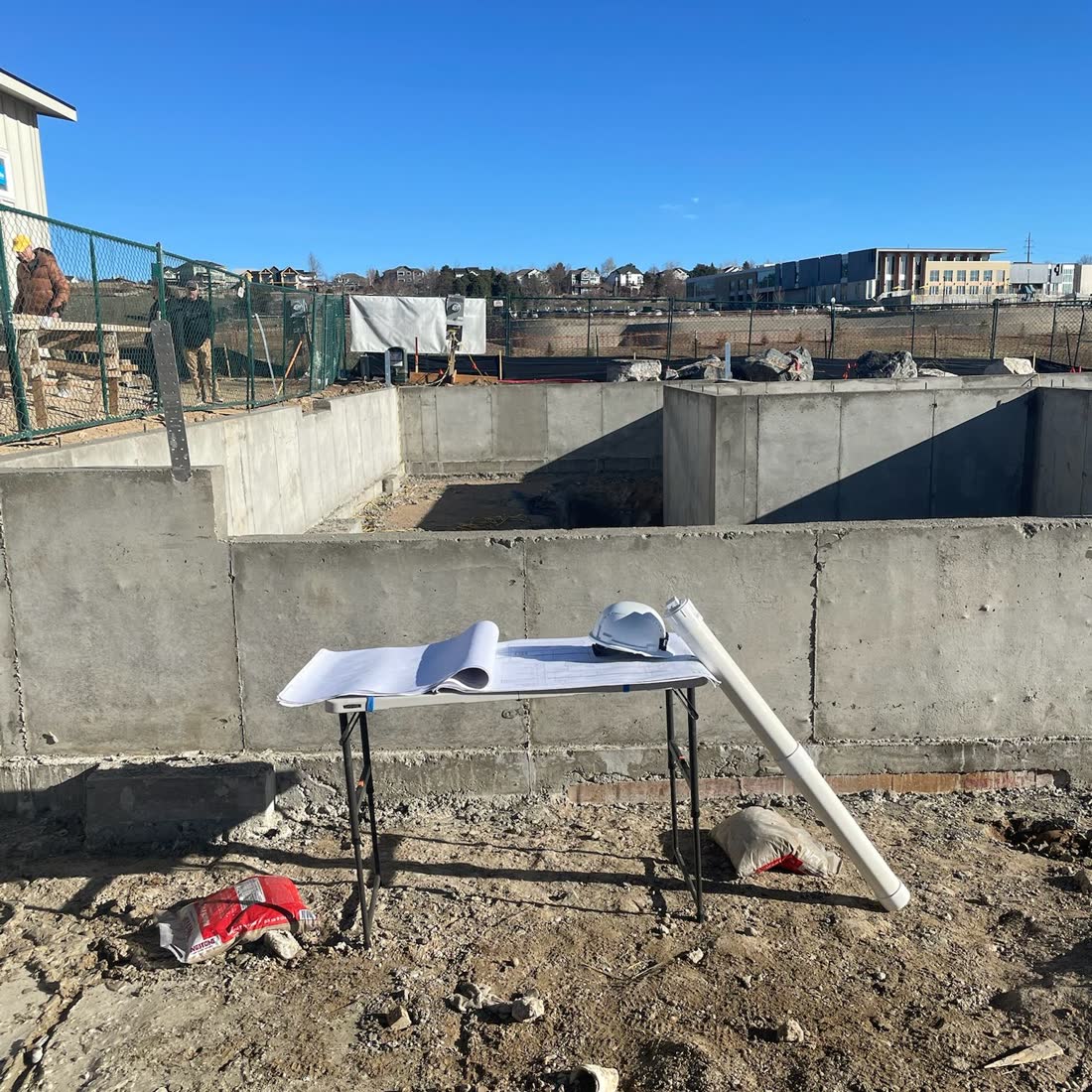 Foundation walls with the plans on site