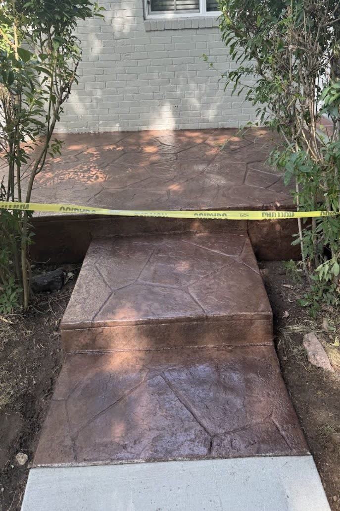 Stamped concrete walkway to a back gate